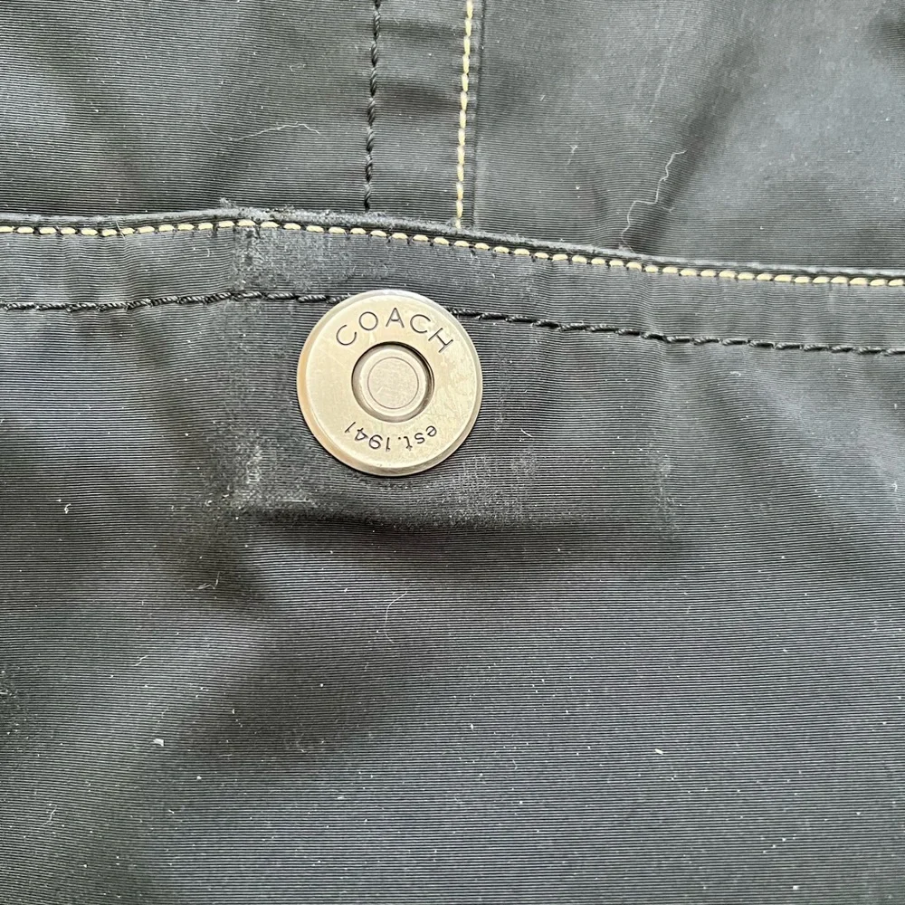 Vintage Coach black nylon leather trimmed flap messenger bag adjustable strap.